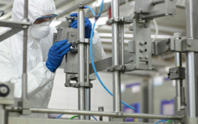 Scientist in lab in overalls